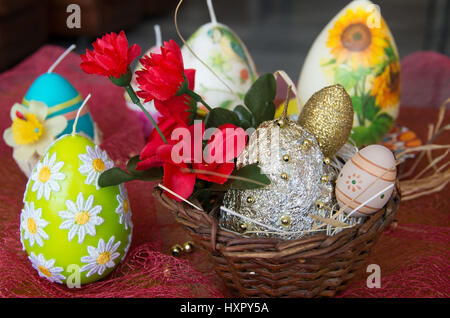Decorated Easter candles in the form of eggs. Stock Photo