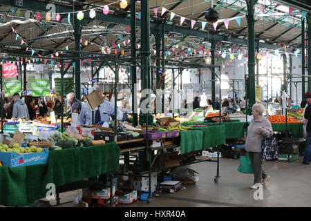 Stalls and people in St George' Market in Belfast, Northern Ireland. The city market in Belfast, St George's has a different market on various days an Stock Photo
