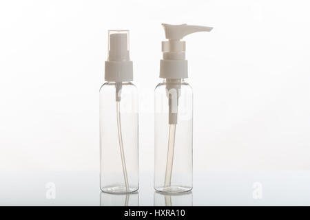 Empty transparent cosmetic bottles isolated on white background Stock Photo