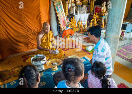Local people and monk in the Wat Phnom Sampeau temple near Battambang, Cambodia, Asia. Stock Photo