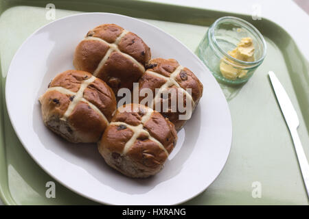 In 12th century an Anglican monk baked the buns and marked them with a cross in honor of Good Friday. they became a symbol of Easter weekend. Stock Photo