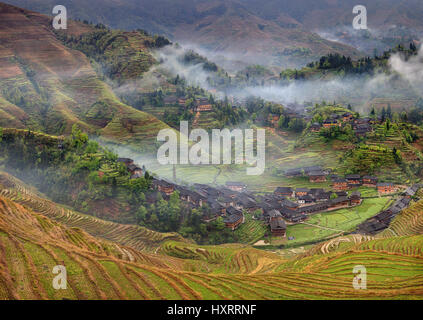 Yao Village Dazhai, Longsheng, near the town of Guilin, Guangxi Province, China - April 5, 2010: Spring landscape with village and rice terraces, moun Stock Photo