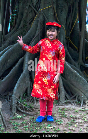 Vietnamese girl in traditional dress for Lunar New Year Stock Photo