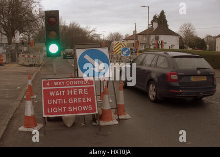 temporary traffic lights on green Stock Photo