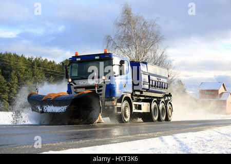 SALO, FINLAND - FEBRUARY 13, 2016: Scania truck equipped with snowplow clears a highway after winter snowfall in South of Finland. Destia takes care o Stock Photo