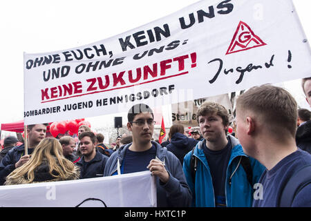 Berlin, Berlin, Germany. 30th Mar, 2017. On the day of the Supervisory Board meeting of Bombardier, 1000 employees from the German sites demonstrate after a call of the trade union IG Metall in front of the company headquarters in Berlin. At Bombardier, a Canadian aircraft and railway group, a total of 5000 jobs will be dropped by the end of 2018. [German: Am Tag der Aufsichtsratsitzung von Bombardier streiken 1000 BeschÃ¤ftigte aus den deutschen Standorten nach Aufruf der Gewerkschaft IG Metall vor der Firmenzentrale in Berlin. Credit: ZUMA Press, Inc./Alamy Live News Stock Photo