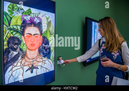 London, UK. 30th Mar, 2017. Works by Frida Kahlo are favourited/liked by visitors - From Selfie to Self-Expression at the Saatchi Gallery. The exhibition looks at the history of the Selfie from portrait artists though to modern day selfies and features self-portraits by Rembrandt, Van Gogh, Lucian Freud, Cindy Sherman, Tracey Emin, through to modern day selfies from Kim Kardashian, Hillary Clinton, Ryan Gosling, Trump and others. Credit: Guy Bell/Alamy Live News Stock Photo