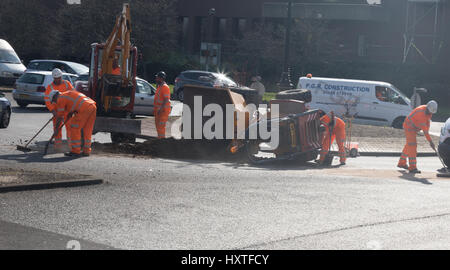 Peterborough, UK. 30th March 2017. Overturned truck at busy roundabout Peterborough. Traffic was held up as a truck overturned while turning in city centre roundabout. Police van arrives to direct traffic. Stock Photo