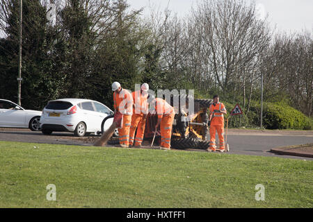 Peterborough, UK. 30th March 2017. Overturned truck at busy roundabout Peterborough. Traffic was held up as a truck overturned while turning in city centre roundabout. Police van arrives to direct traffic. Stock Photo