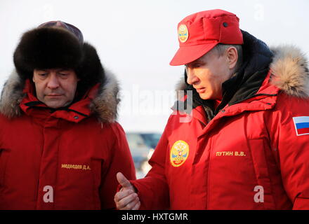 Alexandra Land, Russia. 29th Mar, 2017. Russian President Vladimir Putin and Prime Minister Dmitry Medvedev, left, wearing winter polar gear during a visit to Alexandra Land March 29, 2017 in Franz Josef Land archipelago, Russia. Putin is visiting the remote arctic islands to promote Russian claims to the regions natural resources. Credit: Planetpix/Alamy Live News Stock Photo