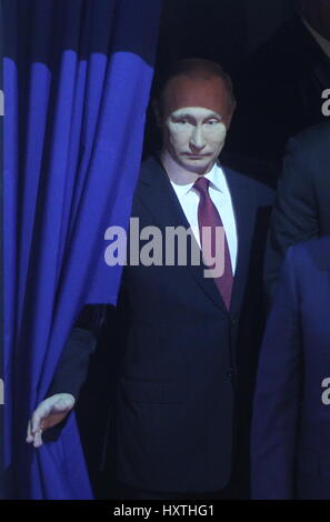 (170330) -- ARKHANGELSK (RUSSIA), March 30, 2017 (Xinhua) -- Russian President Vladimir Putin enters the hall of the 4th International Arctic Forum (IAF) in Arkhangelsk, northwestern Russia, on March 30, 2017. The two-day IAF, themed 'Arctic: Territory of Dialogue,' gathered about 2,300 participants from more than 30 countries this year, including senior government officials, organization leaders and experts. (Xinhua/Lu Jinbo) Stock Photo