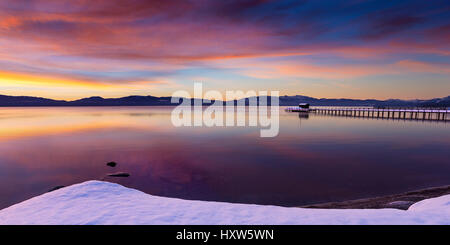 Early morning winter sunrise at Commons Beach in Tahoe City, California, Lake Tahoe. Stock Photo