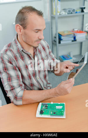 Electrician using a tablet Stock Photo