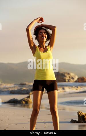 Portrait of a beautiful sports woman laughing after workout Stock Photo