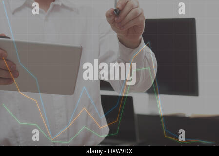 Making business plan graphic on virtual board. Man drawing colorful graphic chart Stock Photo