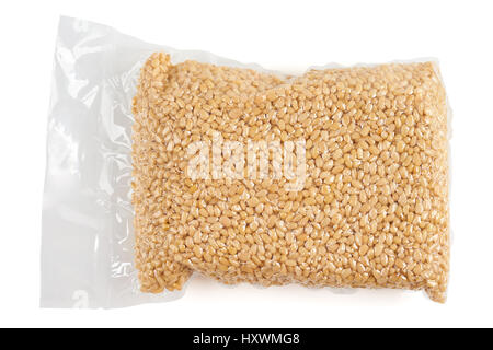 Pine nuts in transparent vacuum package over white Stock Photo