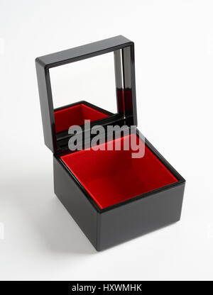 Black plastic glossy gift box with mirror and red bottom isolated on white Stock Photo