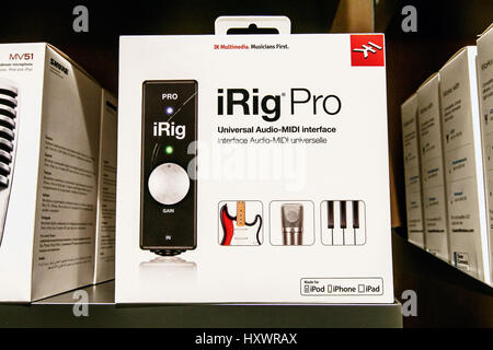 iRig Pro, a universal Audio-MIDI interface device is offered for sale in an Apple store. Stock Photo