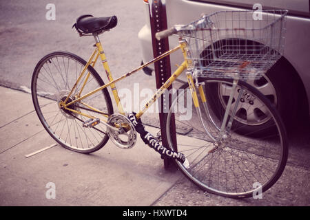 A Peugeot bike with flat tires somewhere in New York, United States of America. Stock Photo