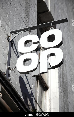 Carmarthen, UK, October 22, 2016 :  Co Op logo advertising sign outside one of its its retail supermarket stores in the city centre Stock Photo
