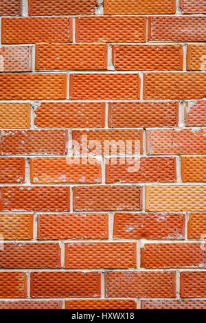 Background of old red and dotted brick wall texture, abstract vertical architecture wallpaper Stock Photo