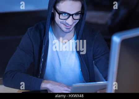 Cheerful happy man using a tablet Stock Photo