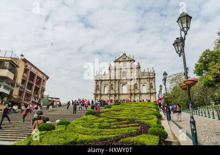 Macau, China - Jan 8, 2013: Ruins of st.paul's, One of macau's best known landmark. Some tourists sightseeing and taking pictures with the ruins Stock Photo