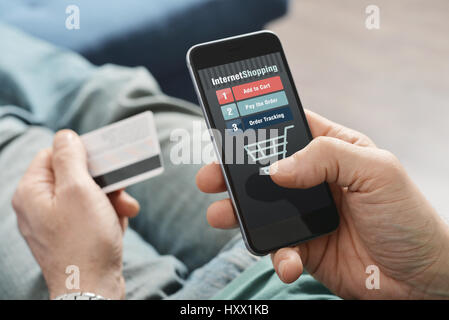 Male hands using smart phone for online shopping Stock Photo