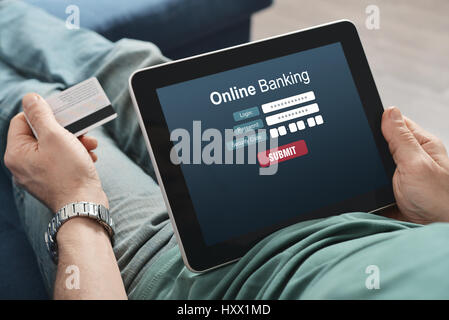 Male hands using online banking on touch screen device Stock Photo