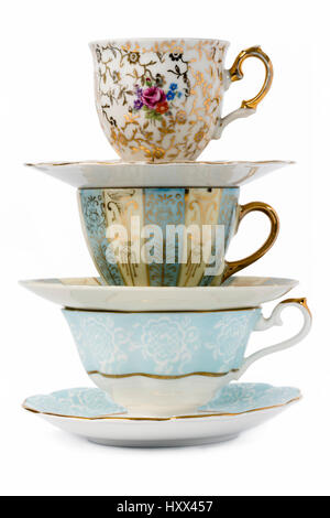 Decorated antique porcelain tea cups with  saucers. Stock Photo