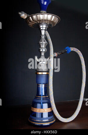 Oriental water pipe on dark black background Stock Photo