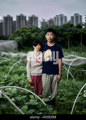 Mapopo Farmers in New Territories, Hong Kong.  Only seven square kilometres of farmland now exist in Hong Kong.  They are fighting government to keep. Stock Photo