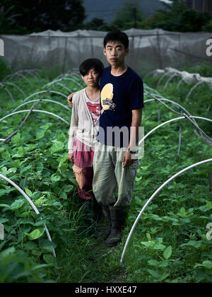 Mapopo Farmers in New Territories, Hong Kong.  Only seven square kilometres of farmland now exist in Hong Kong.  They are fighting government to keep. Stock Photo