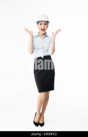 Exited female architect in hard hat screaming on white Stock Photo
