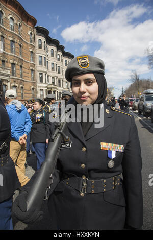 Muslim JROTC high school student marches in the Irish American Parade in Park Slope, Brooklyn, NY. Stock Photo