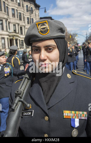 Muslim JROTC high school student marches in the Irish American Parade in Park Slope, Brooklyn, NY. Stock Photo