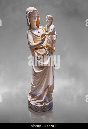 Medieval Gothic ivory statuette of the Virgin and Child , late 13th Paris, the treasury of the Saint Chapelle, Paris. inv 67, The Louvre Museum, Paris Stock Photo