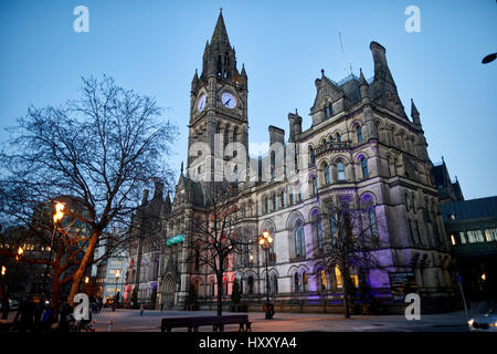 bathed in coloured floodlights Manchester Town hall exterior Albert Square, England, UK . Stock Photo