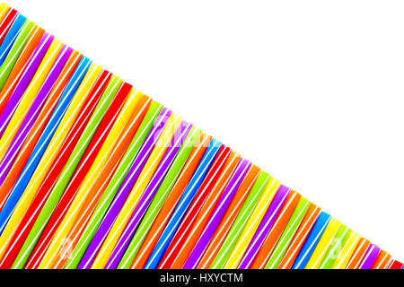 Diagonally arranged large colorful drinking straws on white background with lots of copy space. Stock Photo