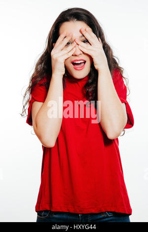 Portrait of surprised young woman covering eyes with amazement. Isolated on white Stock Photo