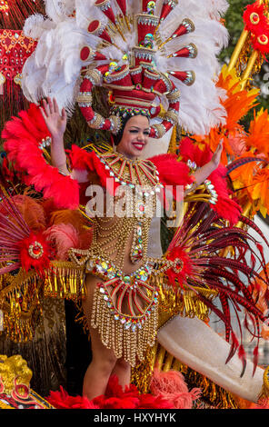 Woman in elaborate costume on enormous decorated float in Tenerife carnival parade Stock Photo