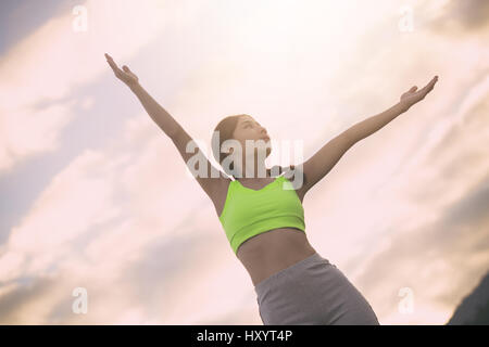 Silhouette fitness woman exercising at sunset time, Vintage Effect Stock Photo