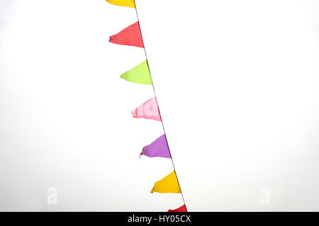 Multicolored flags against the sky Stock Photo