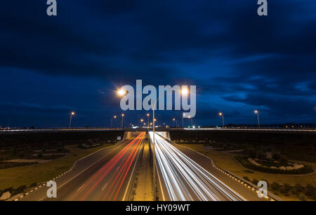 Light trails from cars moving fast late in the evening on a motorway of Nicosia, Cyprus. Concept of high speed. Stock Photo