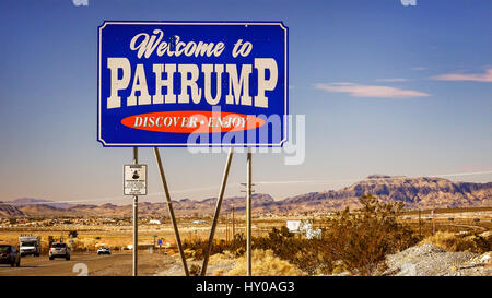 Traffic passes the Welcome to Pahrump Nevada sign Stock Photo