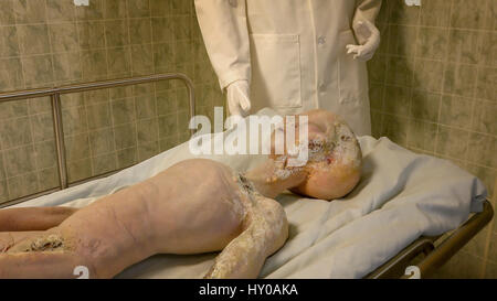 Alien body on gurney being examined after it's spaceship crashed near Roswell. A display at the International UFO Museum and Research Center in Rowsel Stock Photo