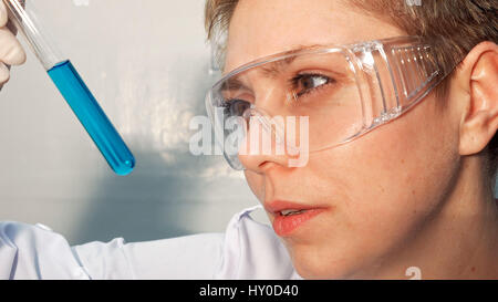 Doctor scientist looking at the test tubes in lab Stock Photo