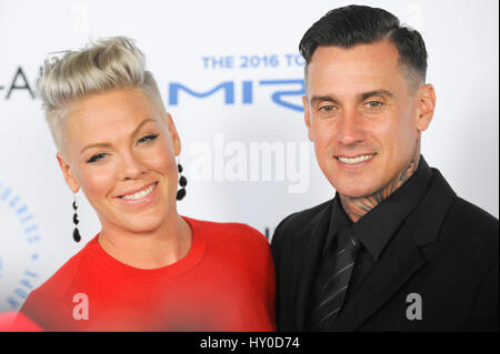 Singer Alecia Beth Moore aka Pink and husband Carey Hart arrive at Autism Speaks blue carpet at the Barker Hanger on October 8th, 2015 in Santa Monica, California, Stock Photo