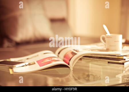 selective focus of the stacking magazine place on table in living room Stock Photo