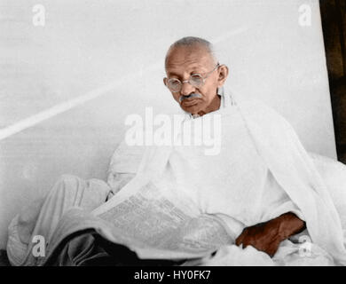 Mahatma Gandhi reading newspaper, India, Asia, 1940, old vintage 1900s picture, Indian freedom fighter, Stock Photo